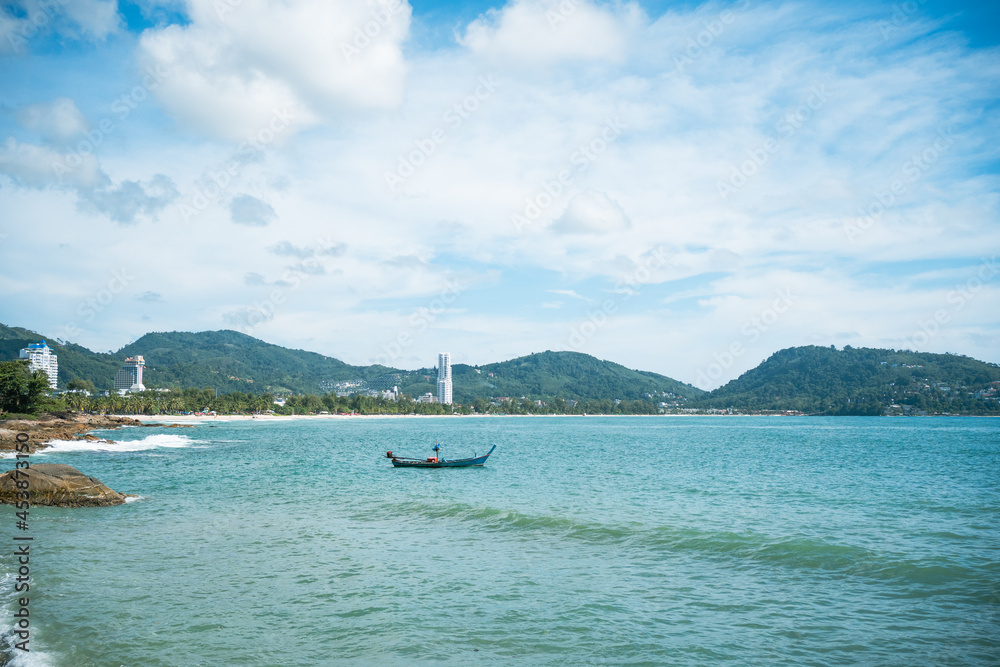 waves nature splashes sand beach on sunlight.blue sea and sky famous beach.