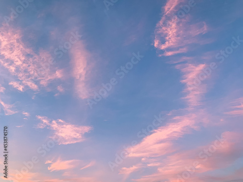 Tender blue sky with some purple clouds background, natural colors © Oksana