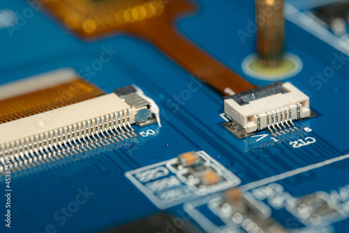 Macro Photo of a Blue PCB with a Ribbon Cable connector