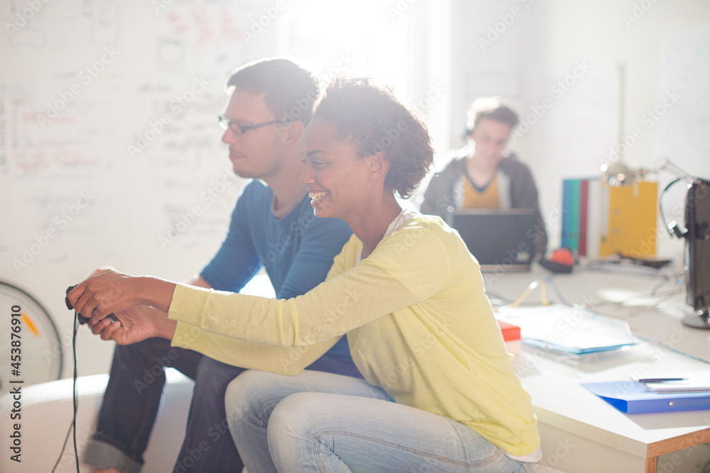 Fototapeta premium Couple playing video games together