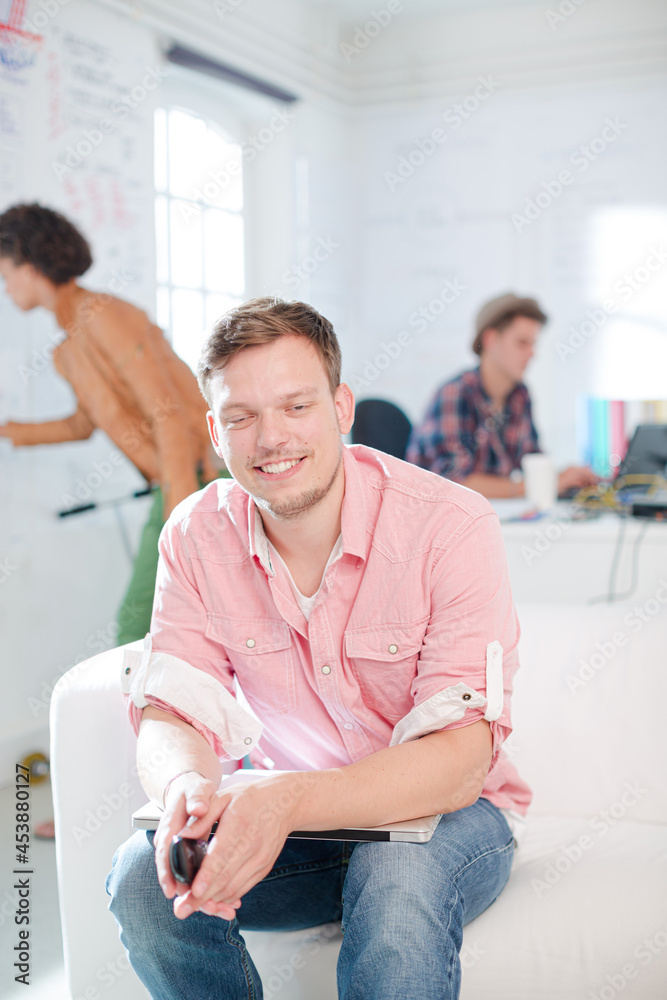 Fototapeta premium Businessman smiling in office