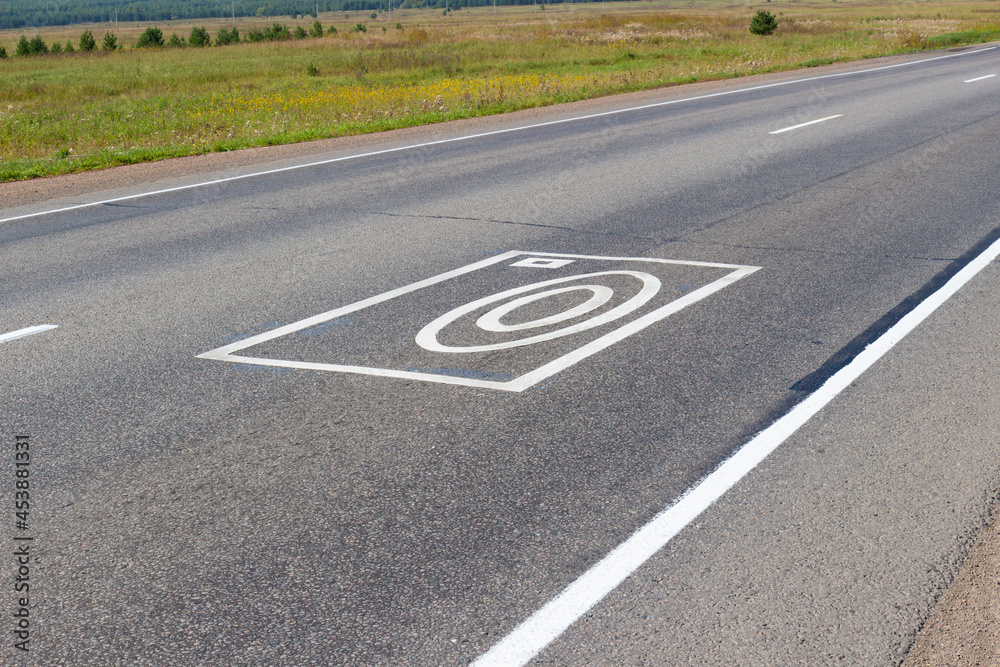 Marking Photo and video recording on the roadway. Markings on the asphalt duplicate road signs and warns about the complex for automatic recording of offenses on the road by drivers