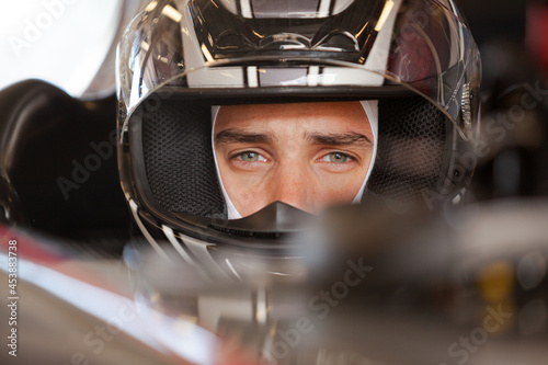 Fotografie, Obraz Close up of racer wearing helmet