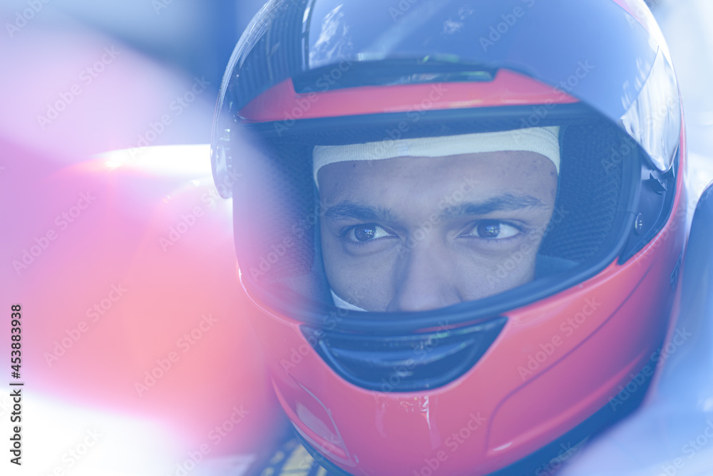 Close up of racer wearing helmet Close up of racer wearing helmet