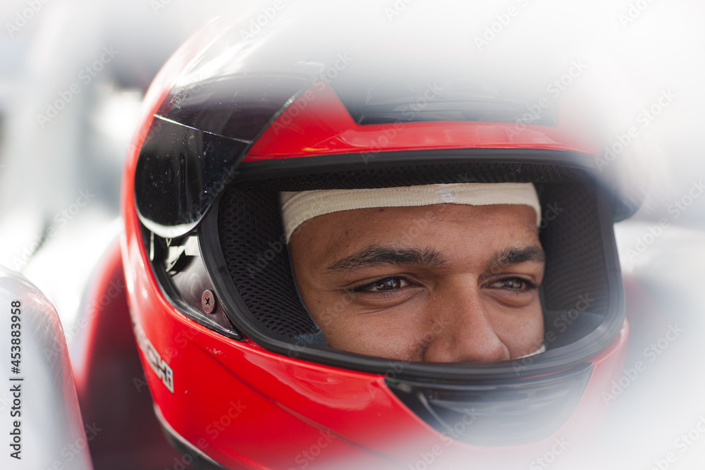 Close up of racer wearing helmet