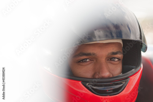 Close up of racer wearing helmet © KOTO