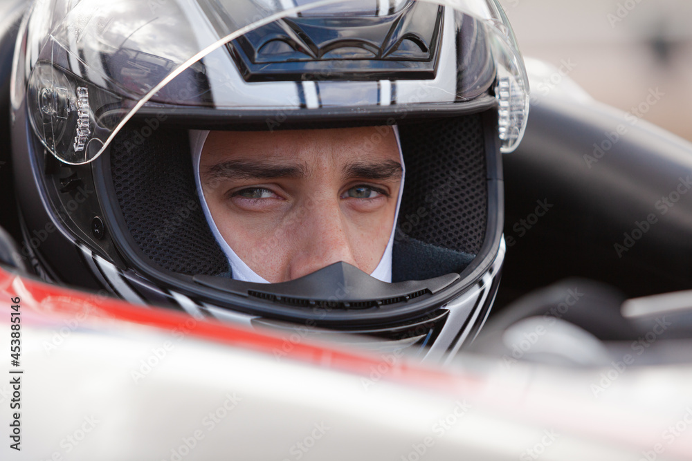Close up of racer wearing helmet Close up of racer wearing helmet