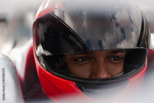 Close up of racer wearing helmet © KOTO