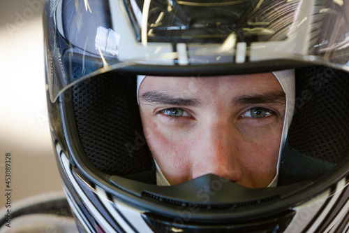 Close up of racer wearing helmet