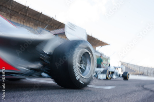 Slika na platnu Blurred view of race car on track