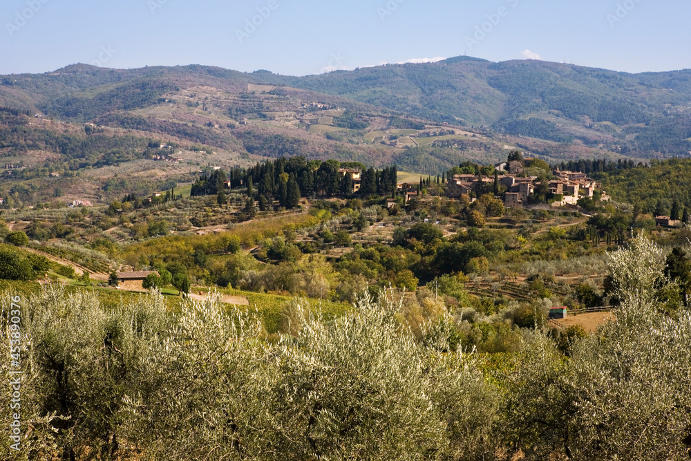 View of the pretty little hill village of Montefioralle and the hills around Greve in Chianti, from the Via di Zano, Tuscany, Italy