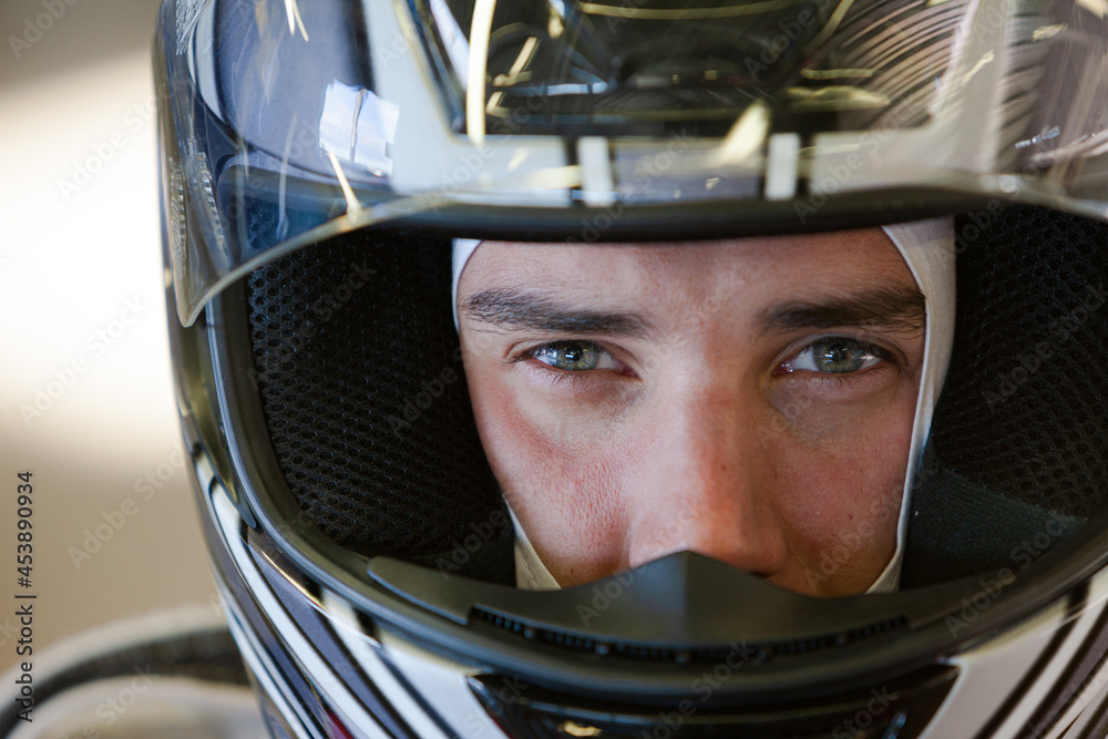 Close up of racer wearing helmet Close up of racer wearing helmet
