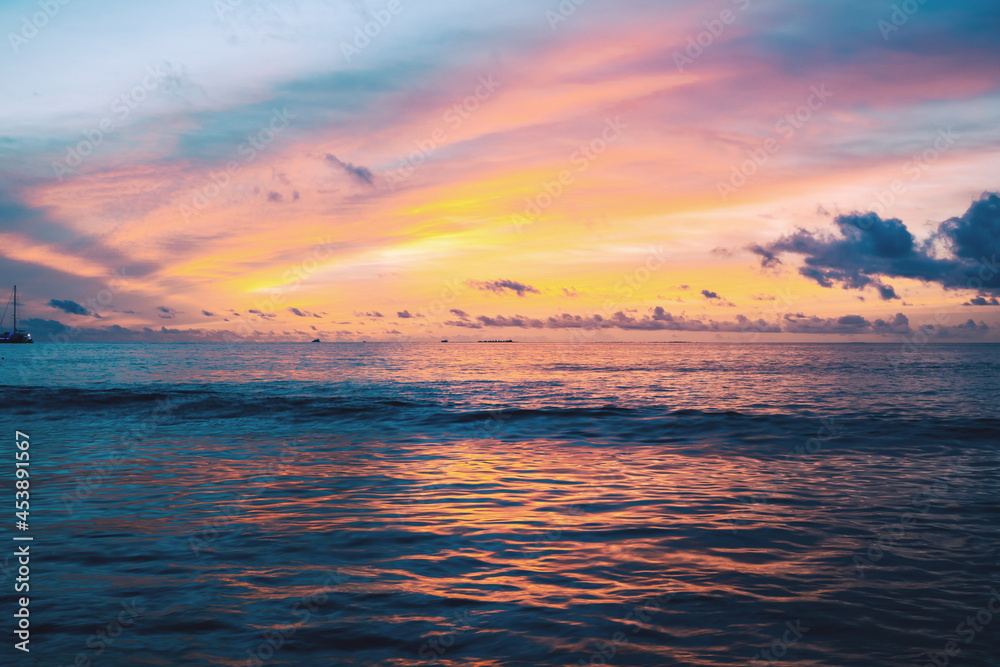 The landscape of a beautiful colored sunset in the Indian Ocean.