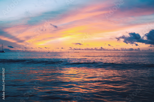 The landscape of a beautiful colored sunset in the Indian Ocean.
