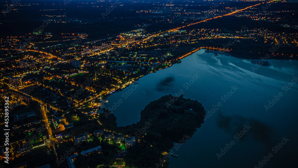 photos of the city of Solnechnogorsk at night.Senezhskoye Lake