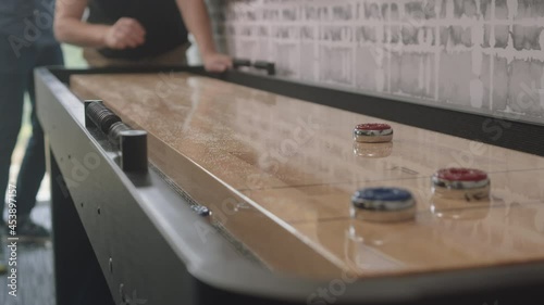 Game Of Indoor Tabletop Shuffleboard photo