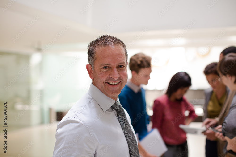 Businessman smiling in meeting Businessman smiling in meeting