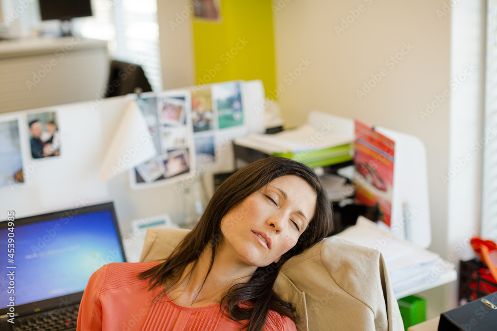 Businesswoman sleeping in chair Businesswoman sleeping in chair