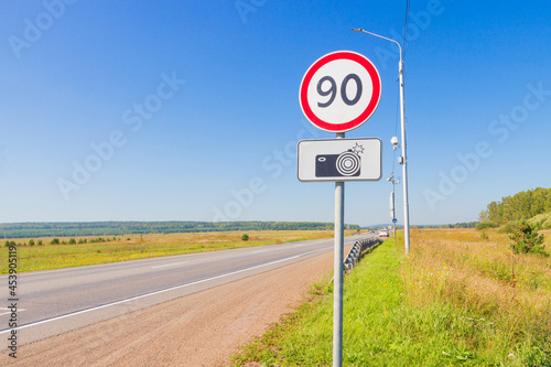 Empty summer rural road with Road sign Maximum speed limits to 90 km per hour and traffic sign Photo and video recording. Traffic code background