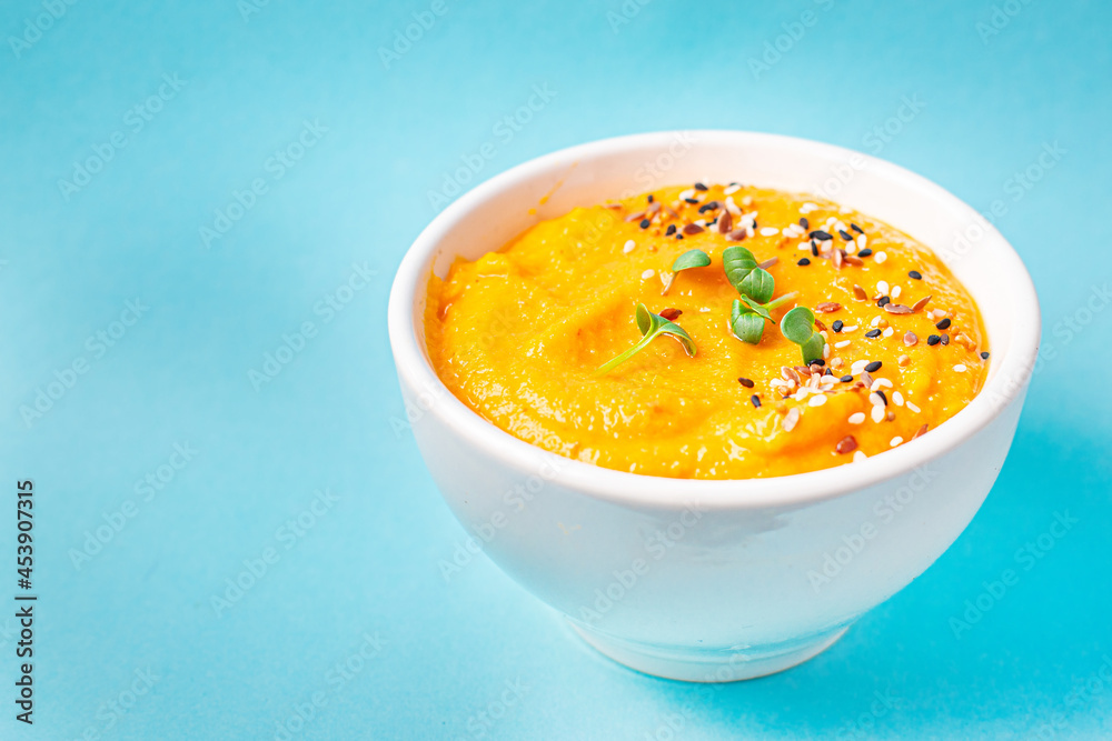 pumpkin cream soup puree fresh portion ready to eat meal snack on the table copy space food background rustic. top view keto or paleo diet veggie vegan or vegetarian food pumpkin cream soup puree fresh portion ready to eat meal snack on the table copy space food background rustic. top view keto or paleo diet veggie vegan or vegetarian food