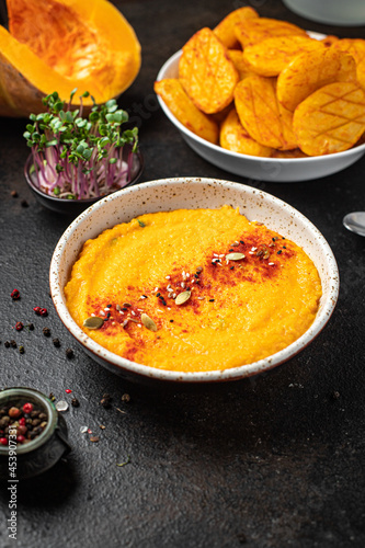 pumpkin cream soup puree fresh portion ready to eat meal snack on the table copy space food background rustic. top view keto or paleo diet veggie vegan or vegetarian food