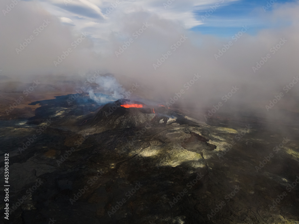 Fototapeta premium Impressive aerial view of the exploding red lava from the Active Volcano in Iceland