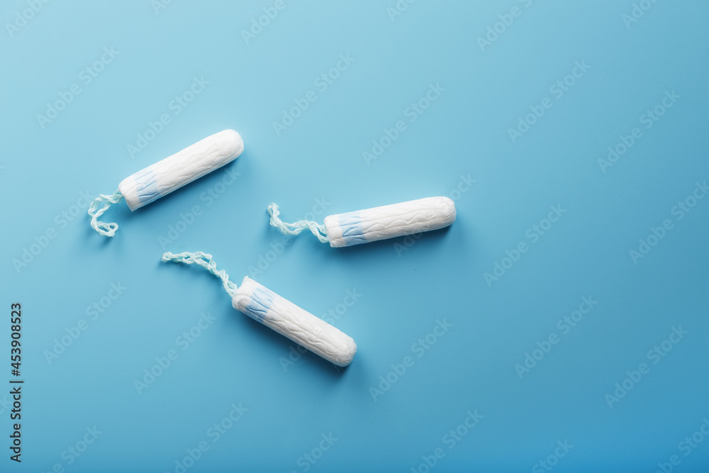 Gynecological tampons on a blue background free space Gynecological tampons on a blue background free space