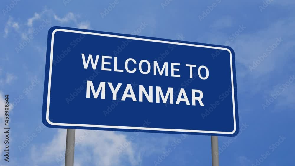 Welcome to Myanmar Road Sign on Clear Blue Sky with Rapid Moving Clouds Welcome to Myanmar Road Sign on Clear Blue Sky with Rapid Moving Clouds