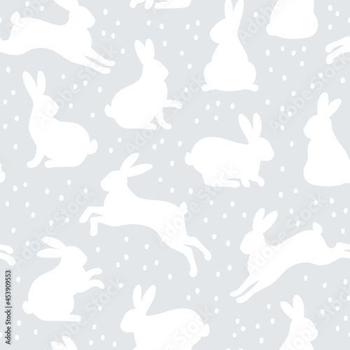 Seamless Pattern with cute bunny rabbits and dots on gray background for kids. Vector illustration. Happy Easter wallpaper. Abstract art print.