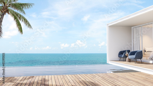 Fototapeta Naklejka Na Ścianę i Meble -  Minimal style house and swimming pool terrace with sea view 3d render,There has wooden floors,decorate with blue fabric chair