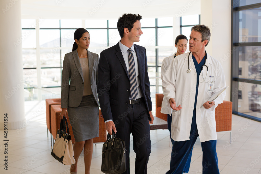 Nurse and senior patient talking in hospital room Nurse and senior patient talking in hospital room