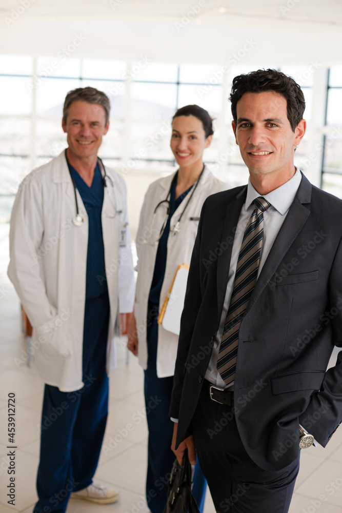 Portrait of smiling doctors and businessman Portrait of smiling doctors and businessman