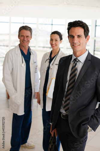 Portrait of smiling doctors and businessman