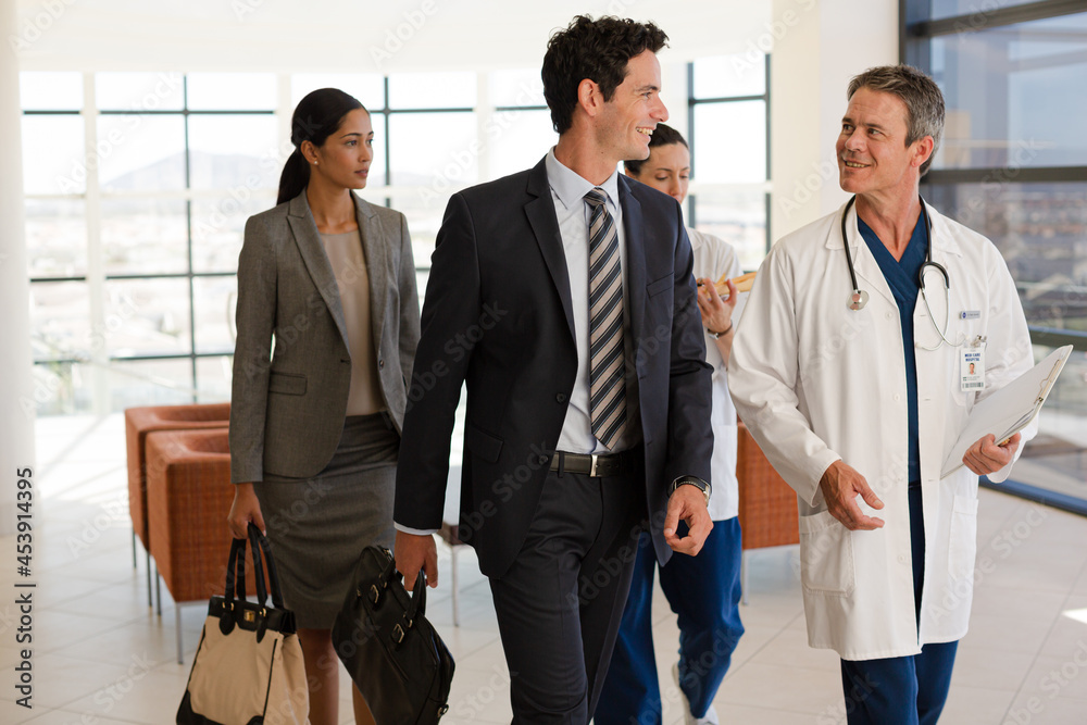 Portrait of smiling businesswoman and doctor in meeting Portrait of smiling businesswoman and doctor in meeting
