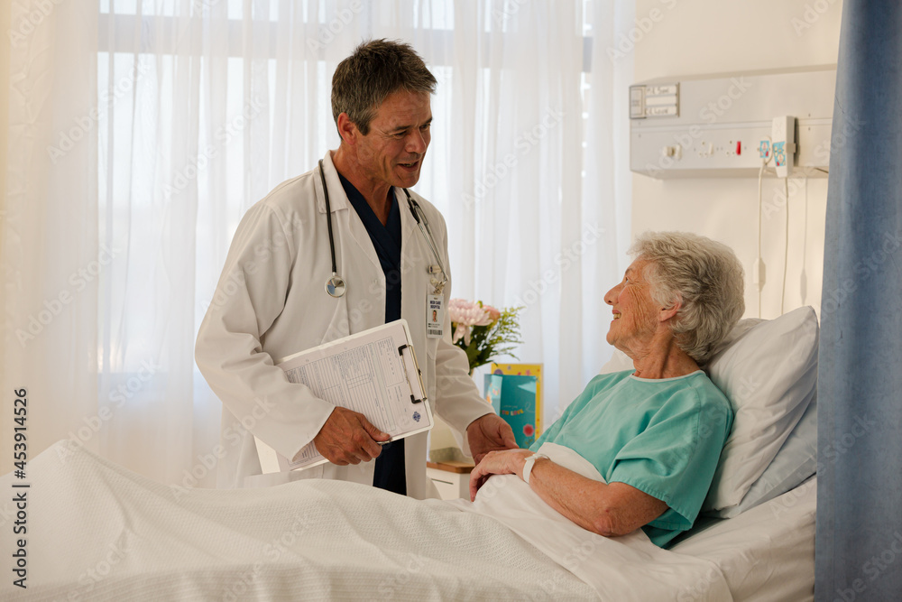 Doctors talking in hospital corridor Doctors talking in hospital corridor