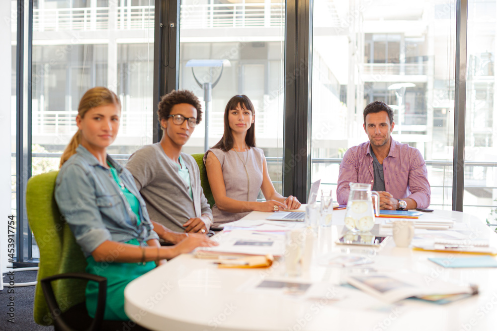 Portrait of business people smiling in meeting