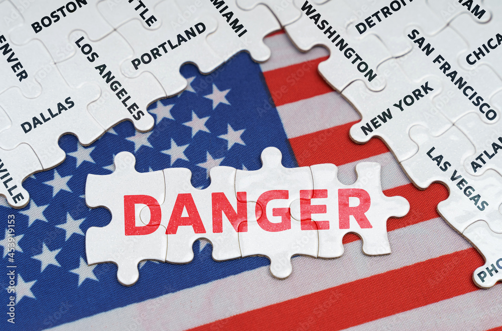 The USA flag has city name puzzles and puzzles with the inscription - Danger