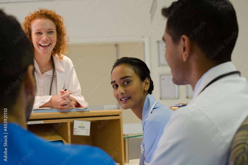 Fototapeta premium Hospital staff talking at front desk