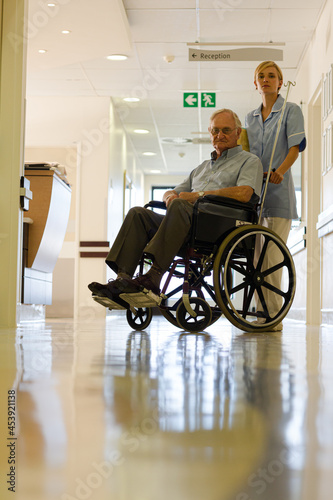 Nurse with older patient in hospital