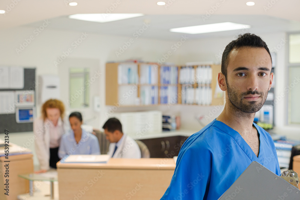 Fototapeta premium Doctor smiling in hospital hallway