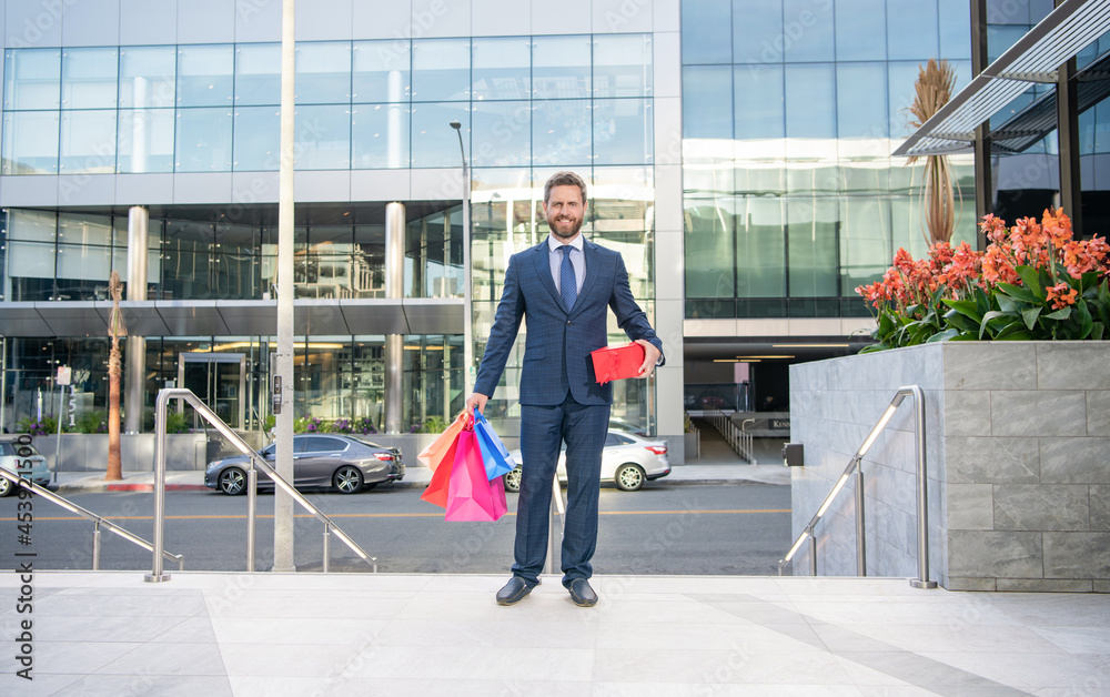 happy business man in formalwear outdoor with shopping bags for holiday, full length, shopping.