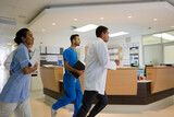 Hospital staff rushing down hallway