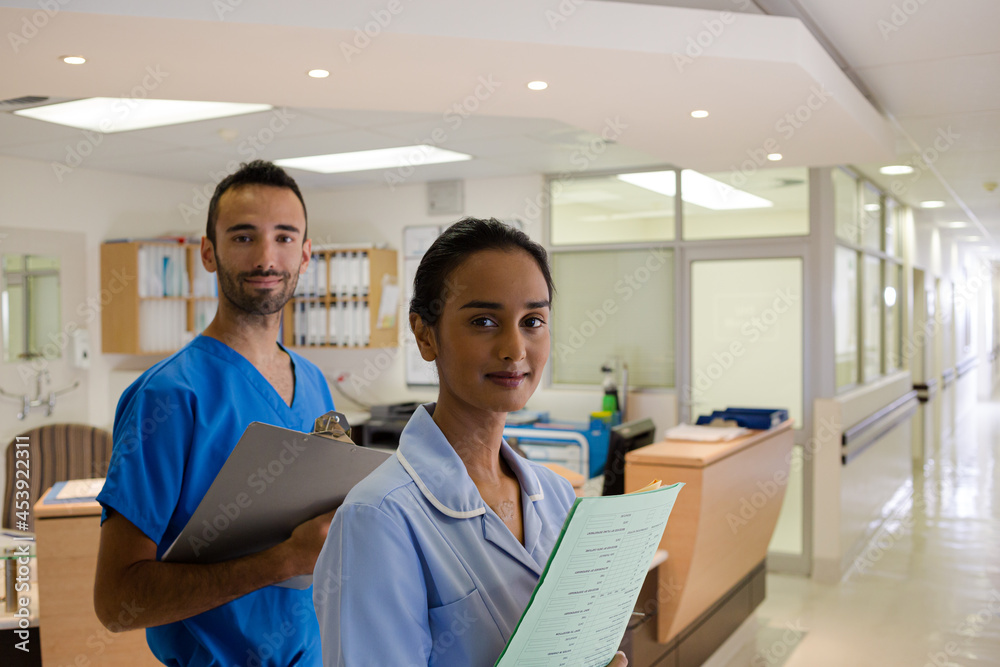 Doctor and nurse standing in hallway Doctor and nurse standing in hallway