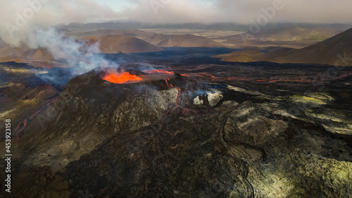 Impressive aerial view of the exploding red lava from the Active Volcano in Iceland © Gian