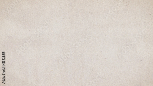 Pale old paper texture. Beige recycled craft paper. Aged cardboard surface background with copy space.