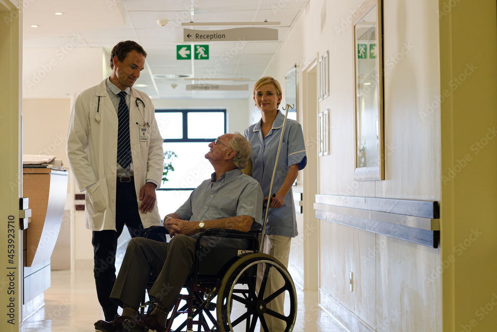 Doctor and nurse with older patient in hospital Doctor and nurse with older patient in hospital
