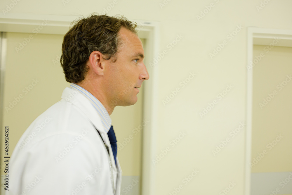 Doctor walking in hospital hallway