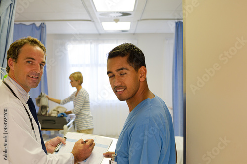 Doctors standing in hospital room