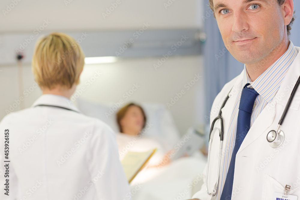 Doctor smiling in hospital room Doctor smiling in hospital room