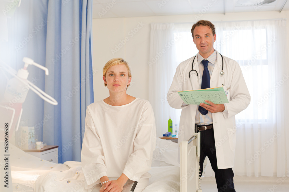 Doctor talking with patient in hospital room Doctor talking with patient in hospital room